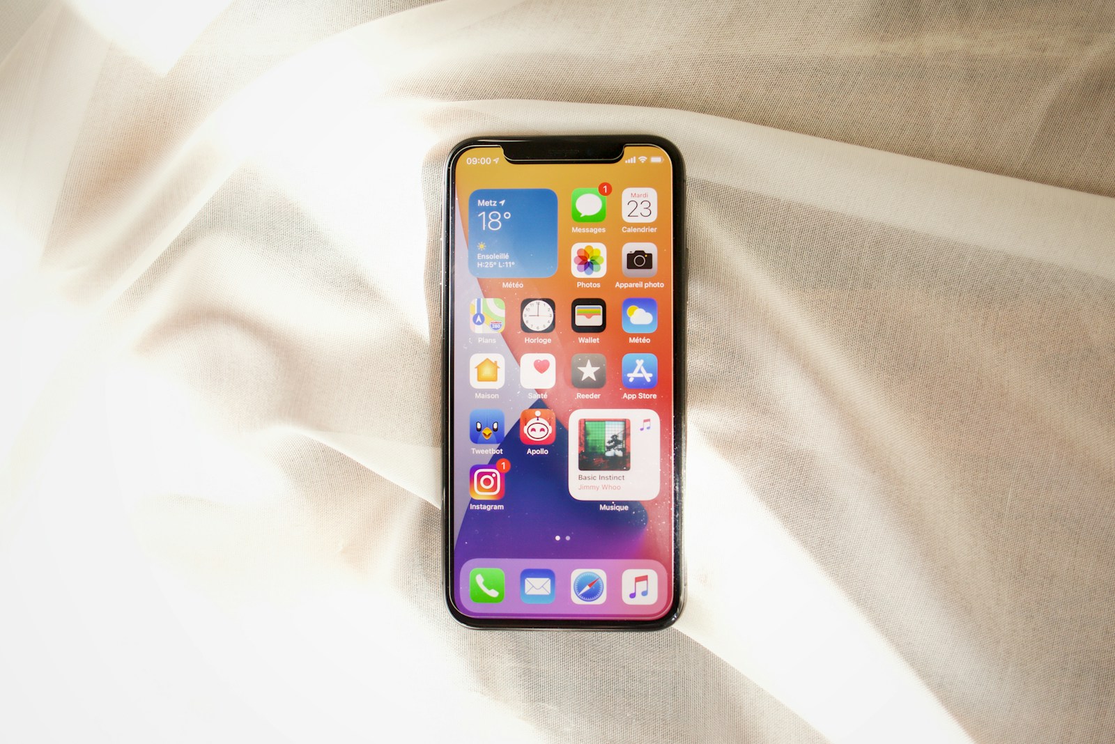 black iphone 4 on white textile